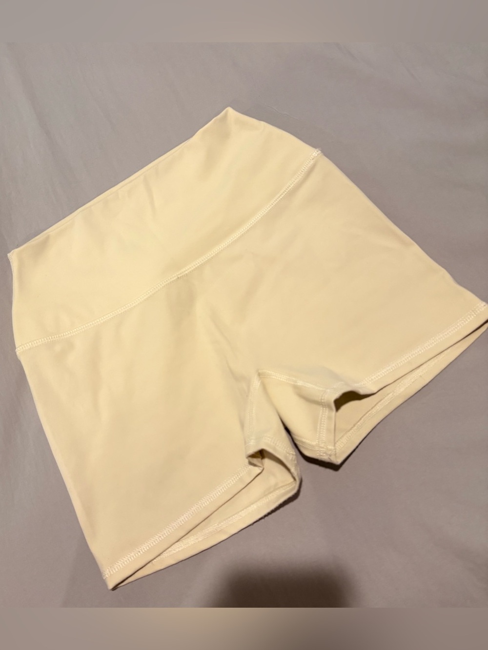 Garage Active Booty Shorts in Anise Flower Yellow. Size S